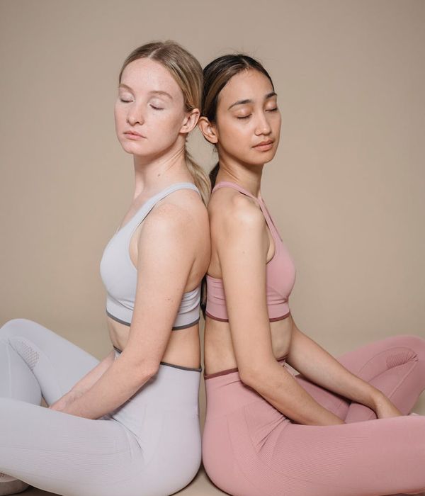 Woman in a calm seated yoga pose, embodying inner balance and focus.